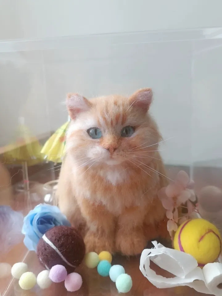 A finished handmade wool felt pet keepsake