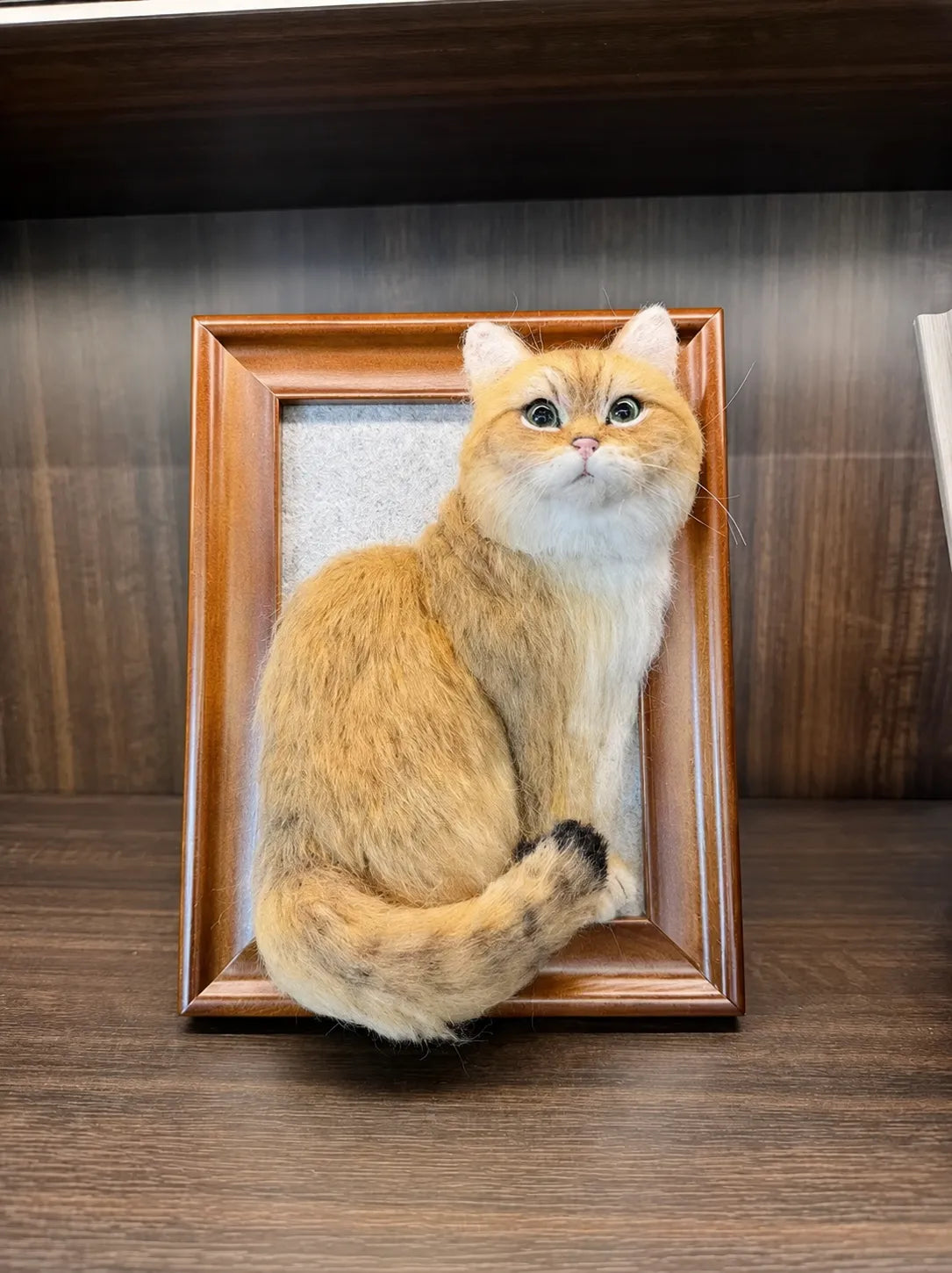 A finished custom wool felt pet keepsake