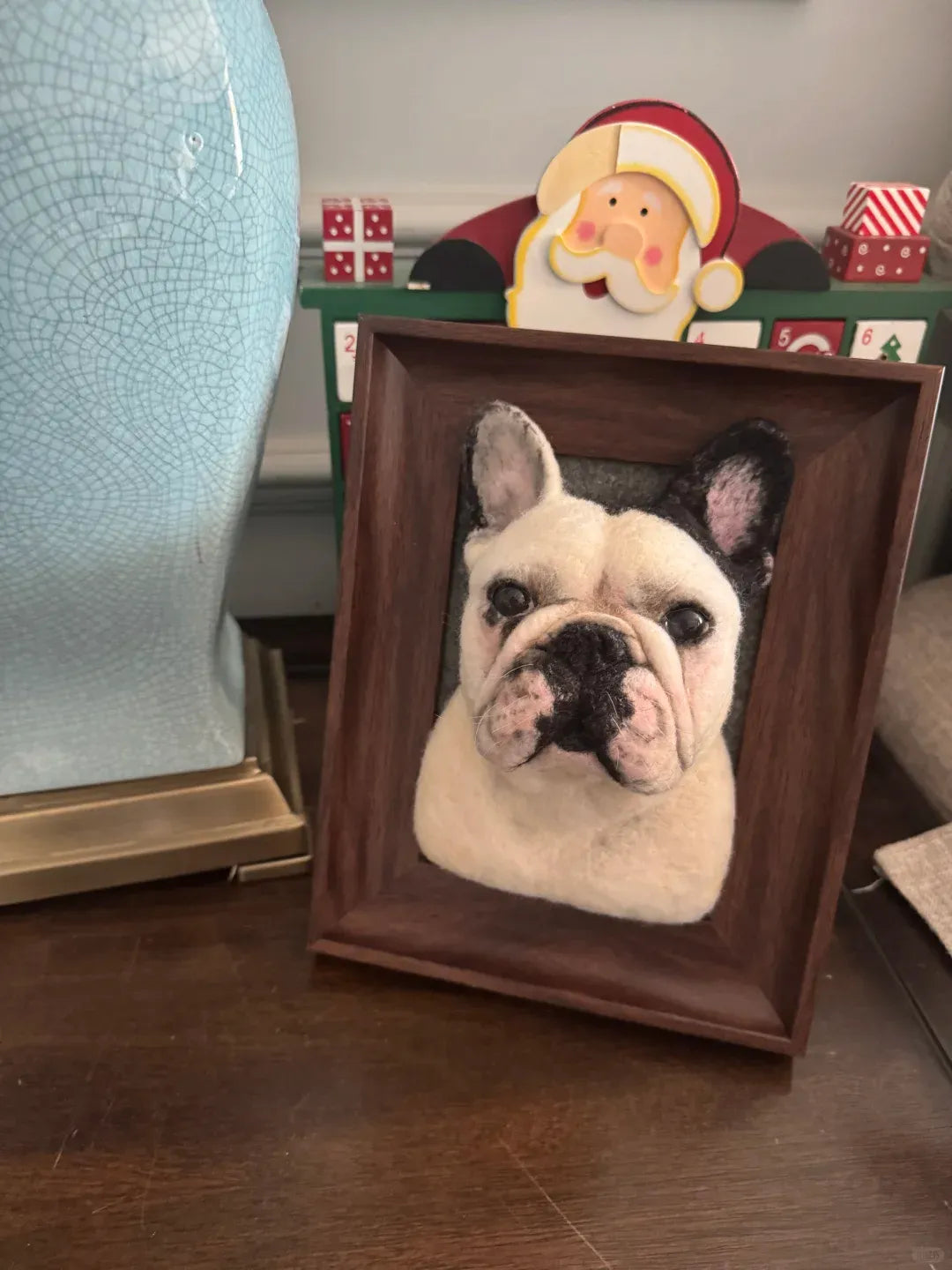 A finished handmade wool felt pet keepsake